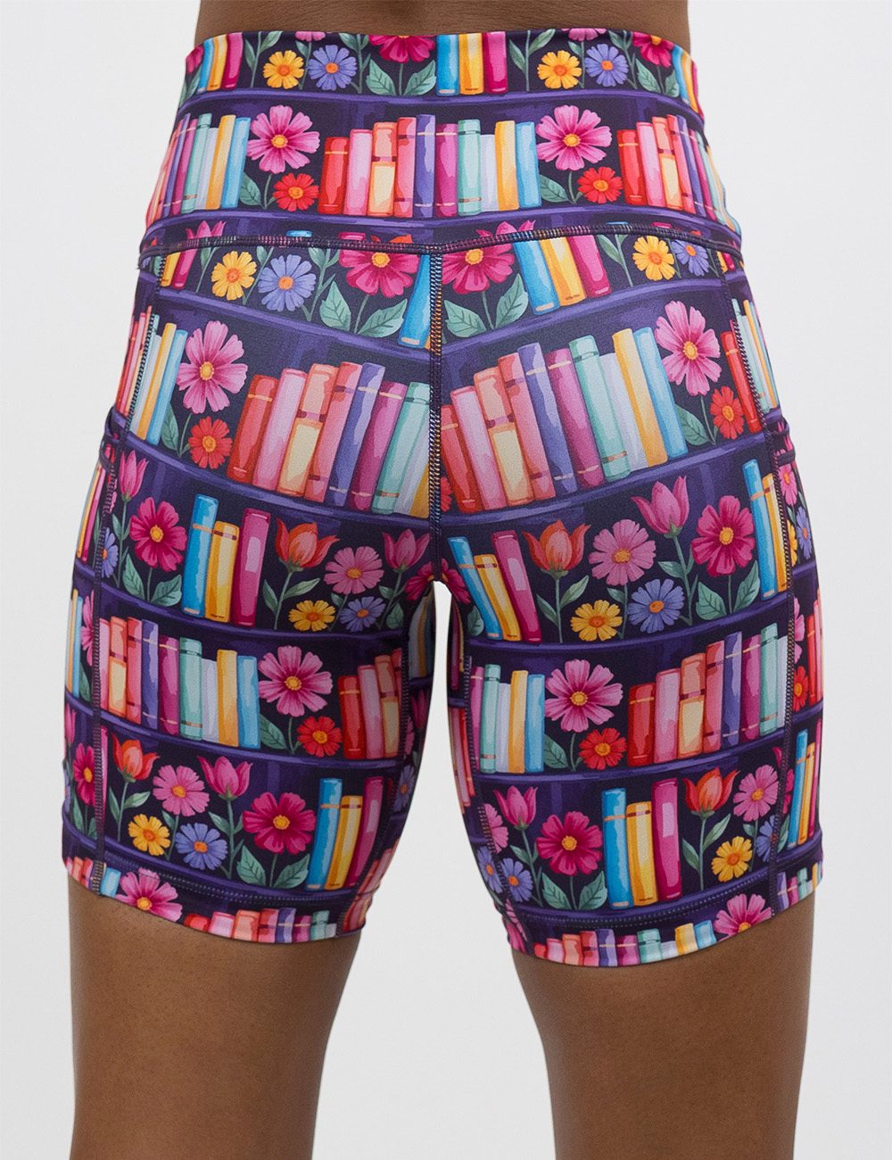 back of the brightly colored books and flowers7 inch shorts against a white background