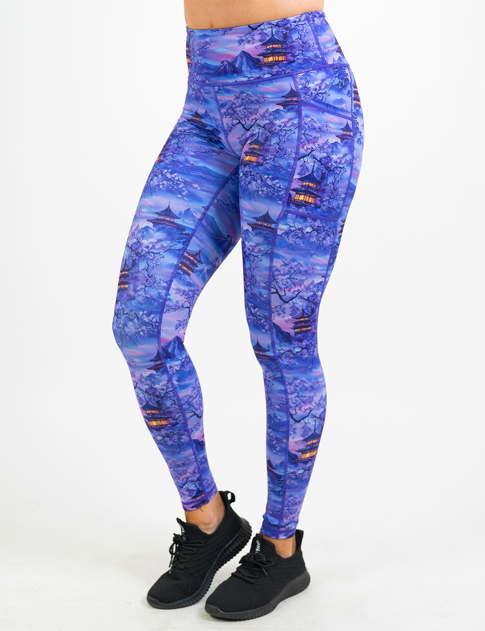 front of the full length lavender and blue floral full length leggings featuring traditional pagodas and blooming cherry trees