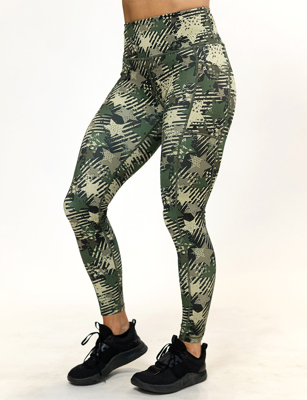 front of the full length green camo stars and stripes leggings against a white background