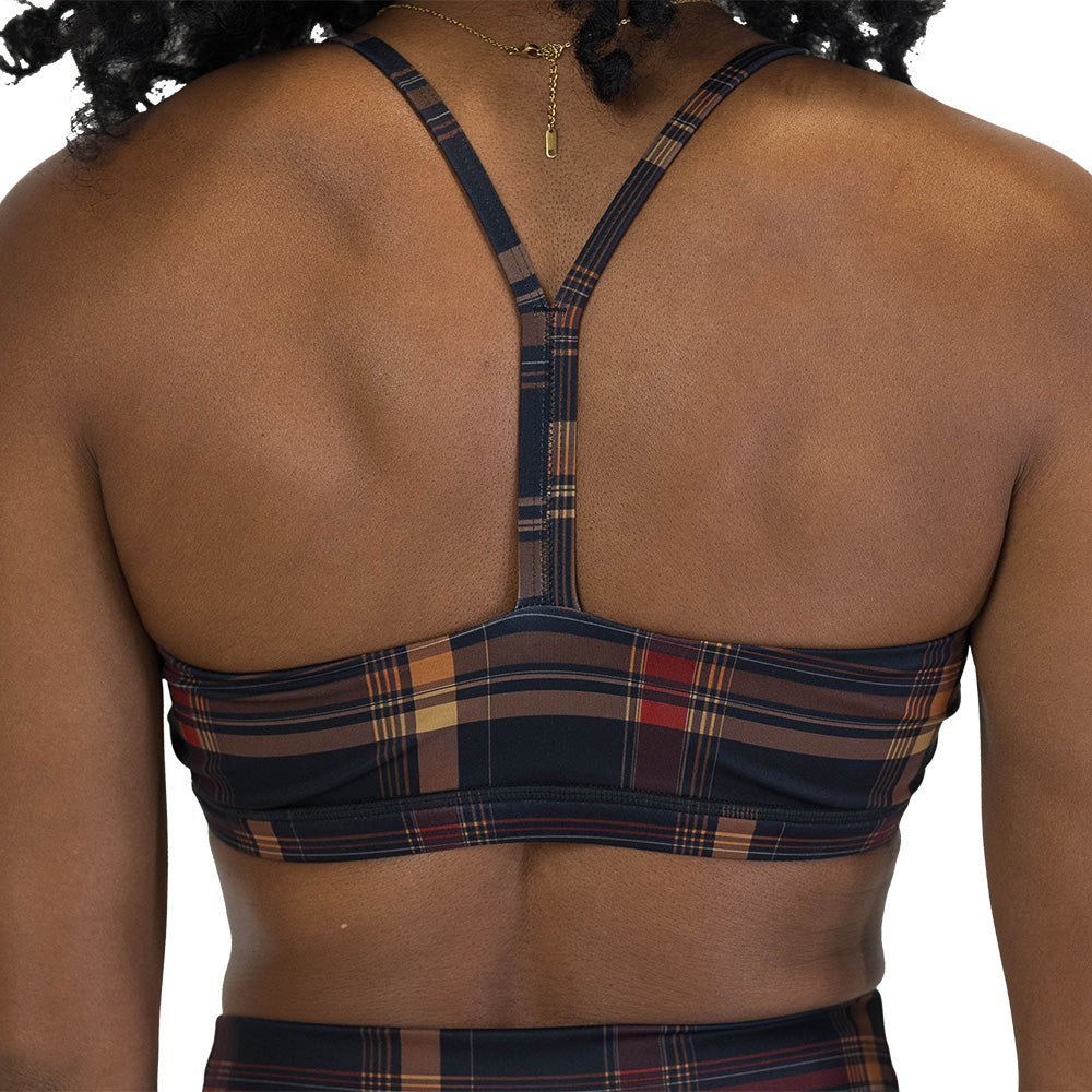 back of the brown, yellow & red plaid patterned sports bra