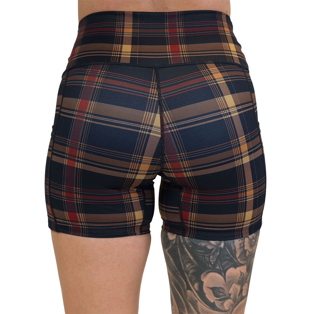 back of the brown, yellow & red plaid patterned shorts