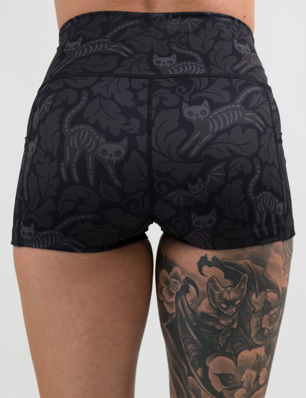 back of the 2.5 inch black and grey bats and cats skeleton shorts against a white background