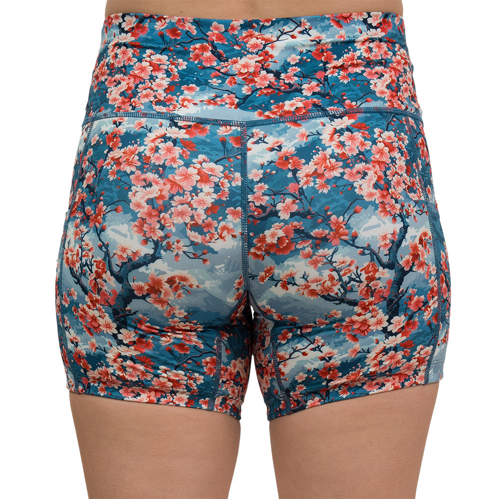 back of blooming cherry tree print 5 inch shorts against a white background