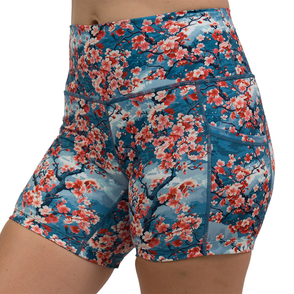 blooming cherry tree print 5 inch shorts facing the side against a white background