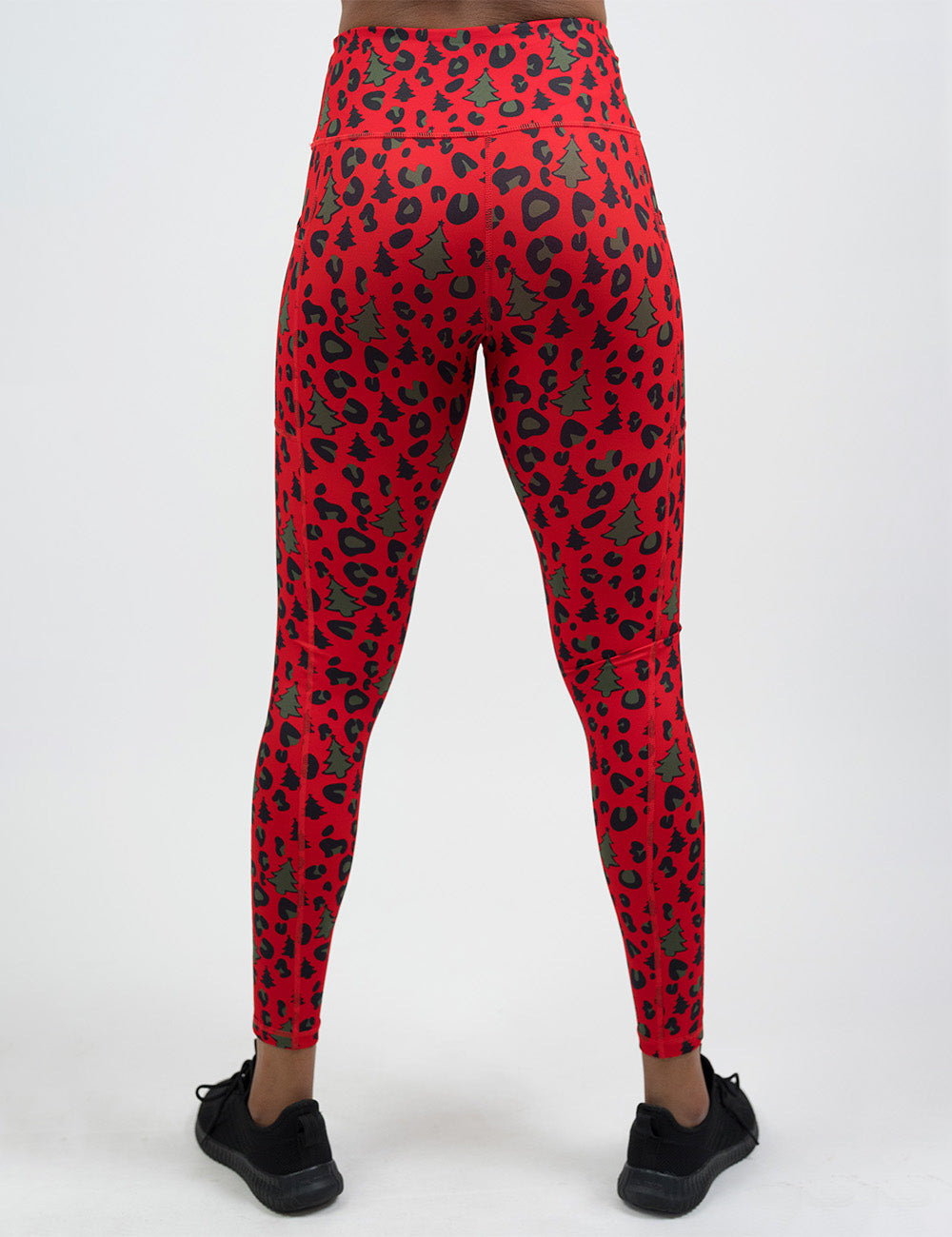 back of the red and brown Christmas trees and leopard print full length leggings against a white background