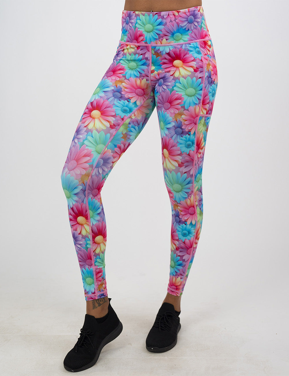 full length colorful flowers leggings facing the front against a white background