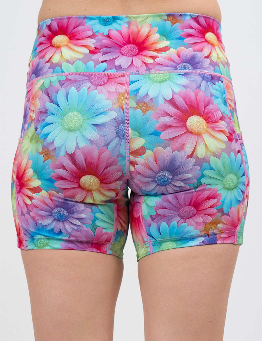back of the 5 inch pastel colored flower shorts against a white background