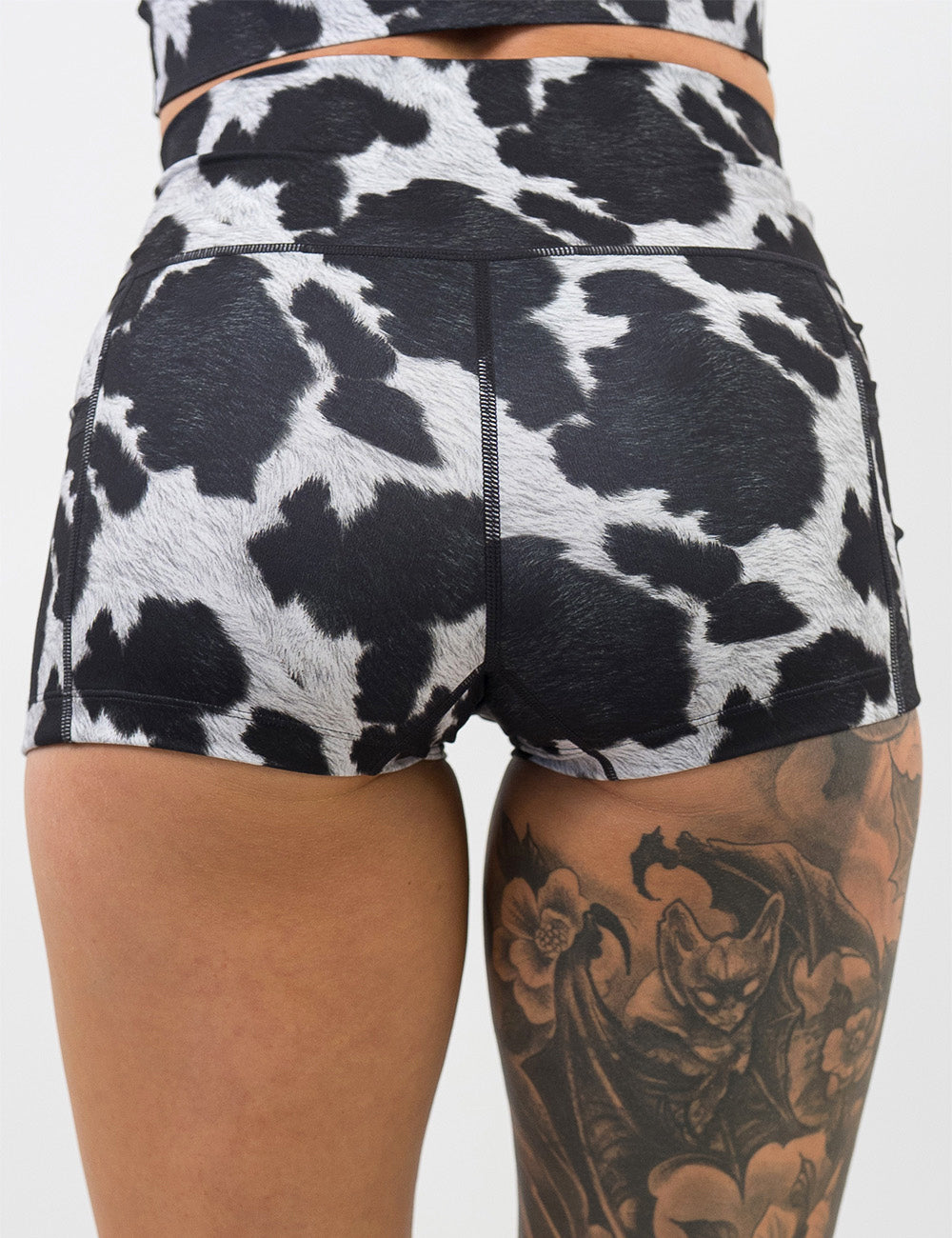back of the 2.5 inch cow print shorts against a white background
