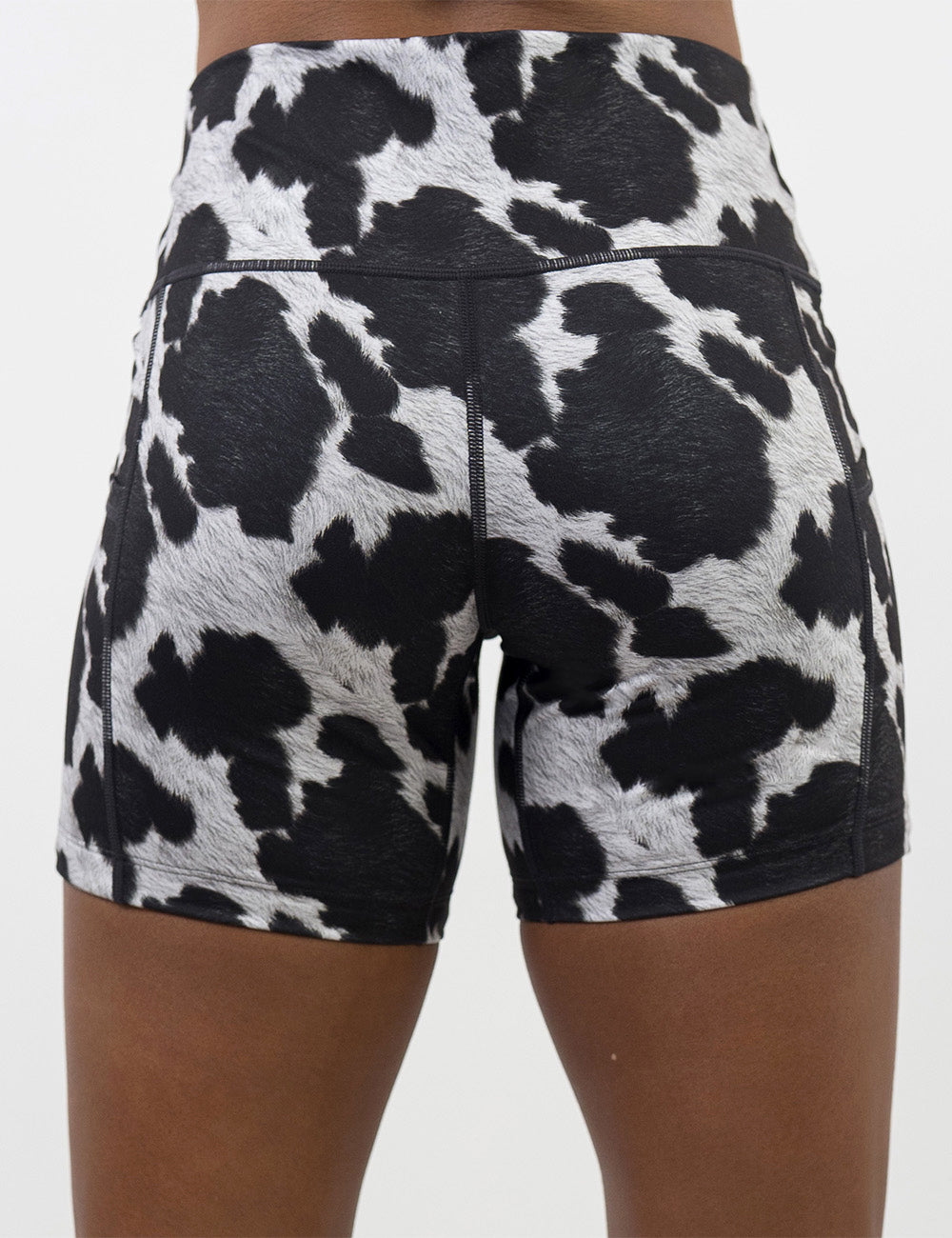 back of the 5 inch cow print shorts against a white background