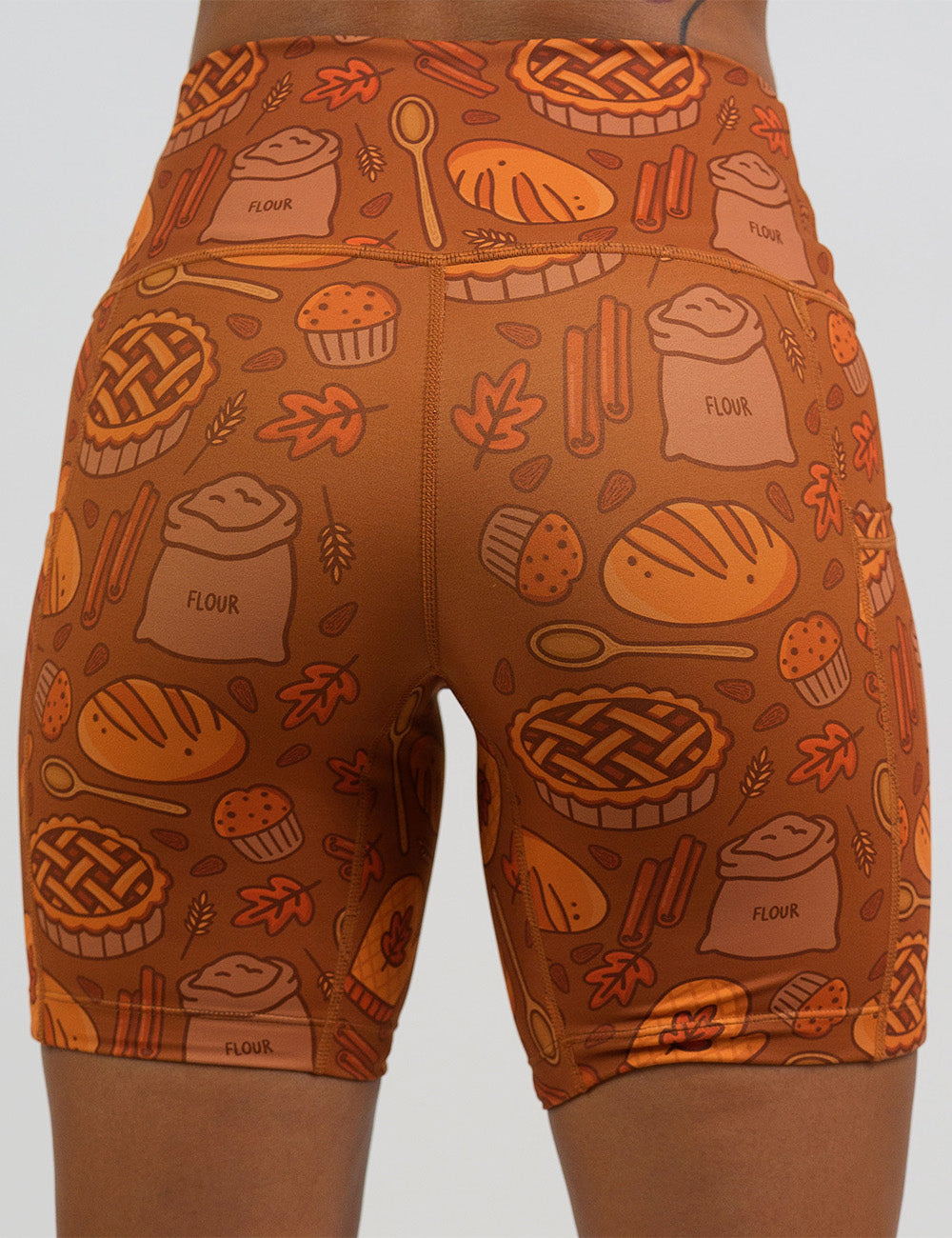 back of the orange baking themed 7 inch shorts against a white background