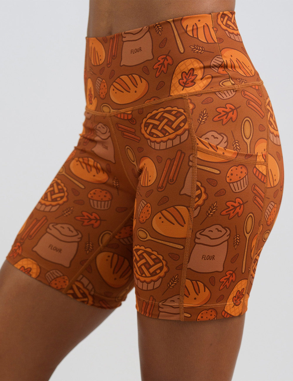 front of the 7 inch orange baking themed shorts against a white background
