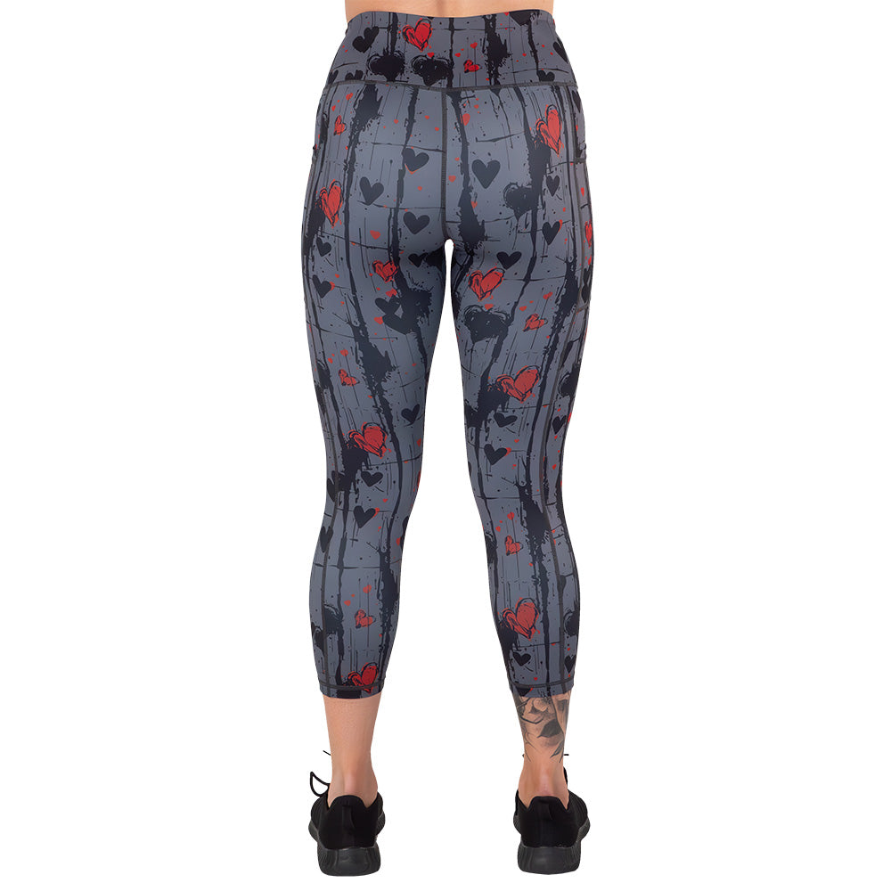 back of the black and red heart patterned leggings