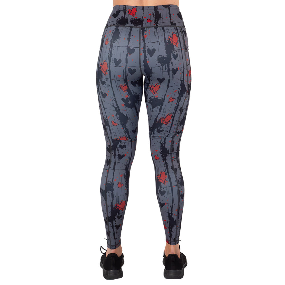 back of the black and red heart patterned leggings