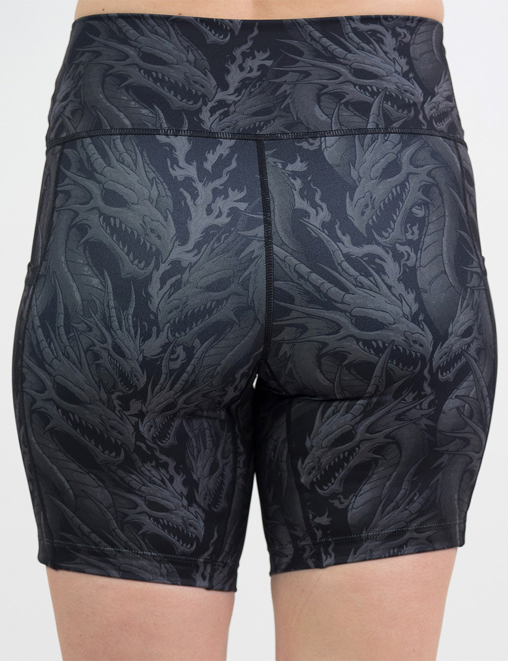 back of the 7 inch black shorts with a grey dragon pattern against a white background