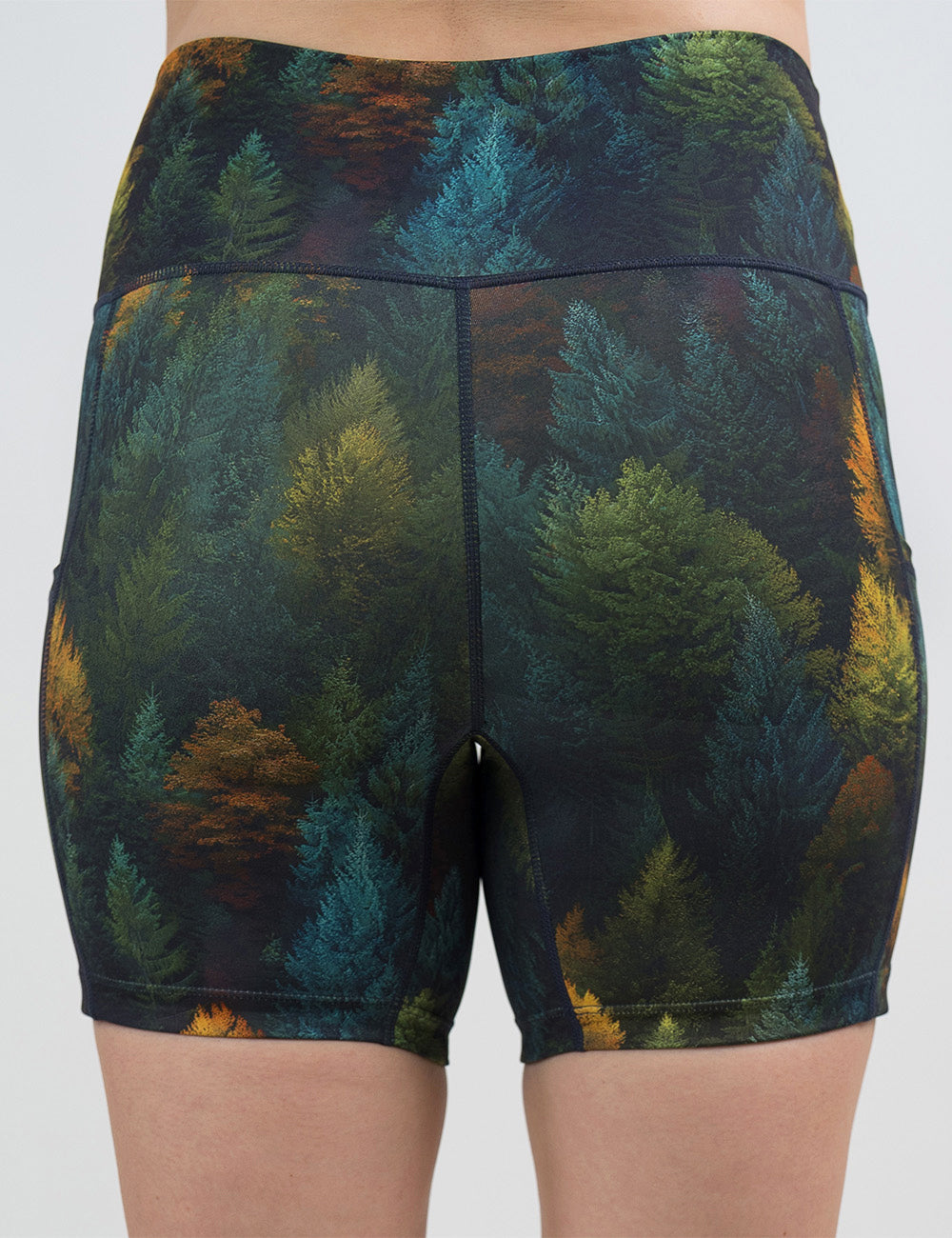 back of the 5 inch orange, green, and bluish green trees shorts against a white background