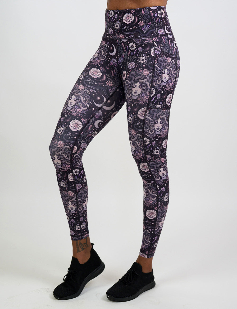 front of the purple medusa with flowers full length leggings against a white background