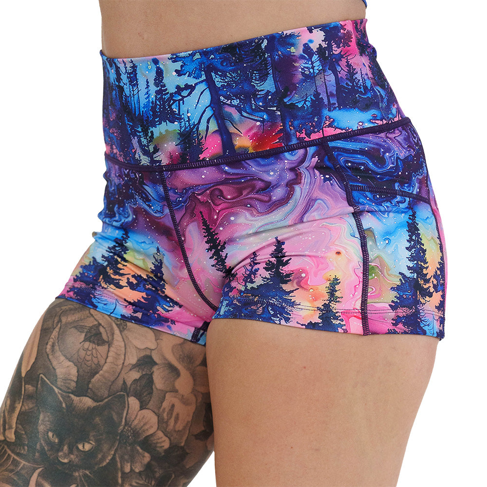 close up of the 2.5 inch watercolor rainbow patterned forest shorts against a white background