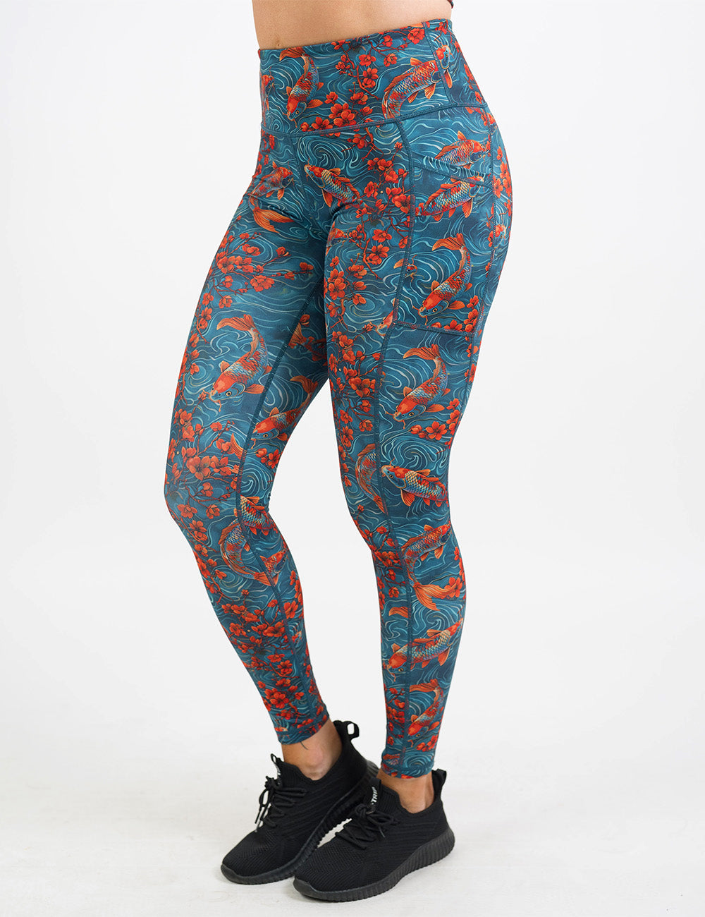 front of the full length koi fish swimming with orange flowers leggings