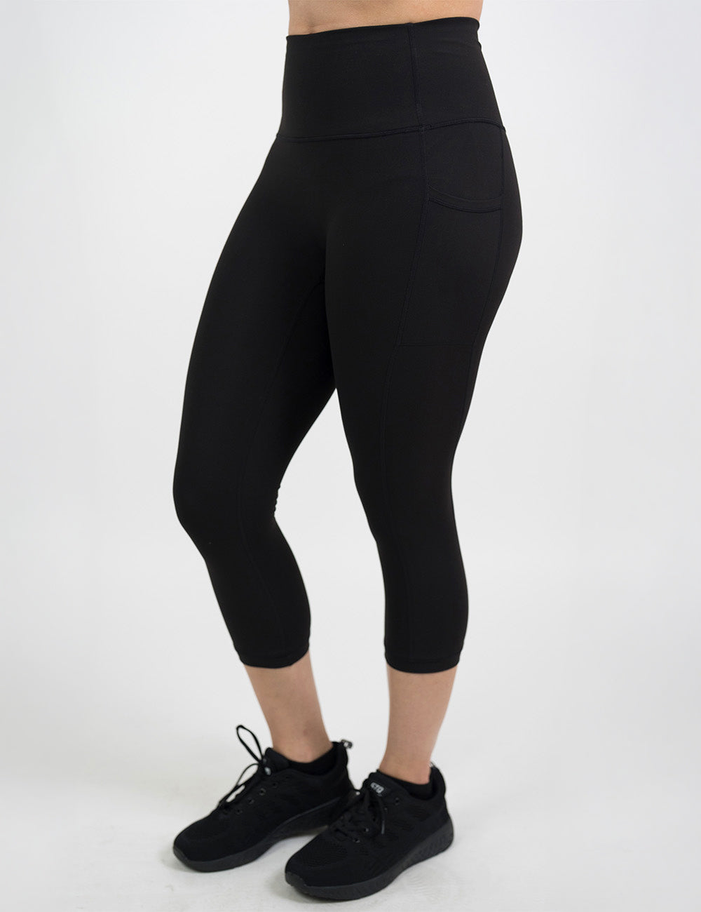 front of the all black essential style capri leggings against a white background