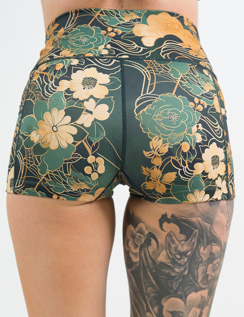back of the 2.5 inch green and gold flower with gold accent shorts