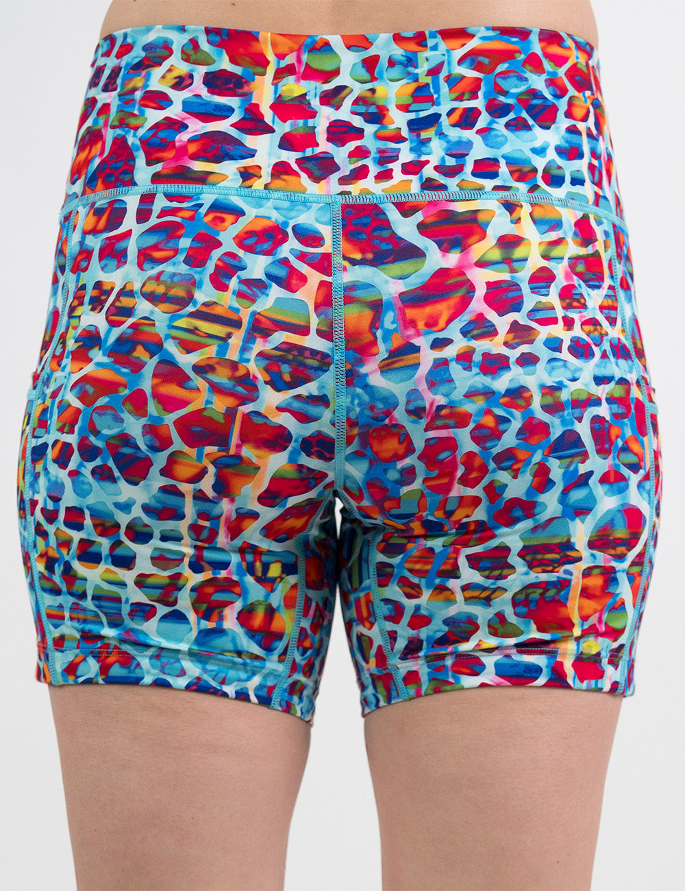 back of the 5 inch red, teal, and yellow mosaic style shorts against a white background
