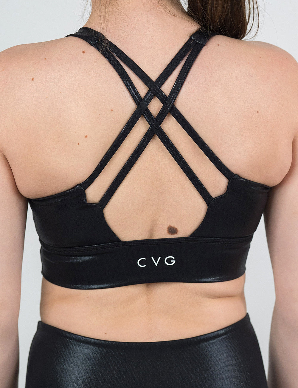 back of the black leather longline bra against a white background