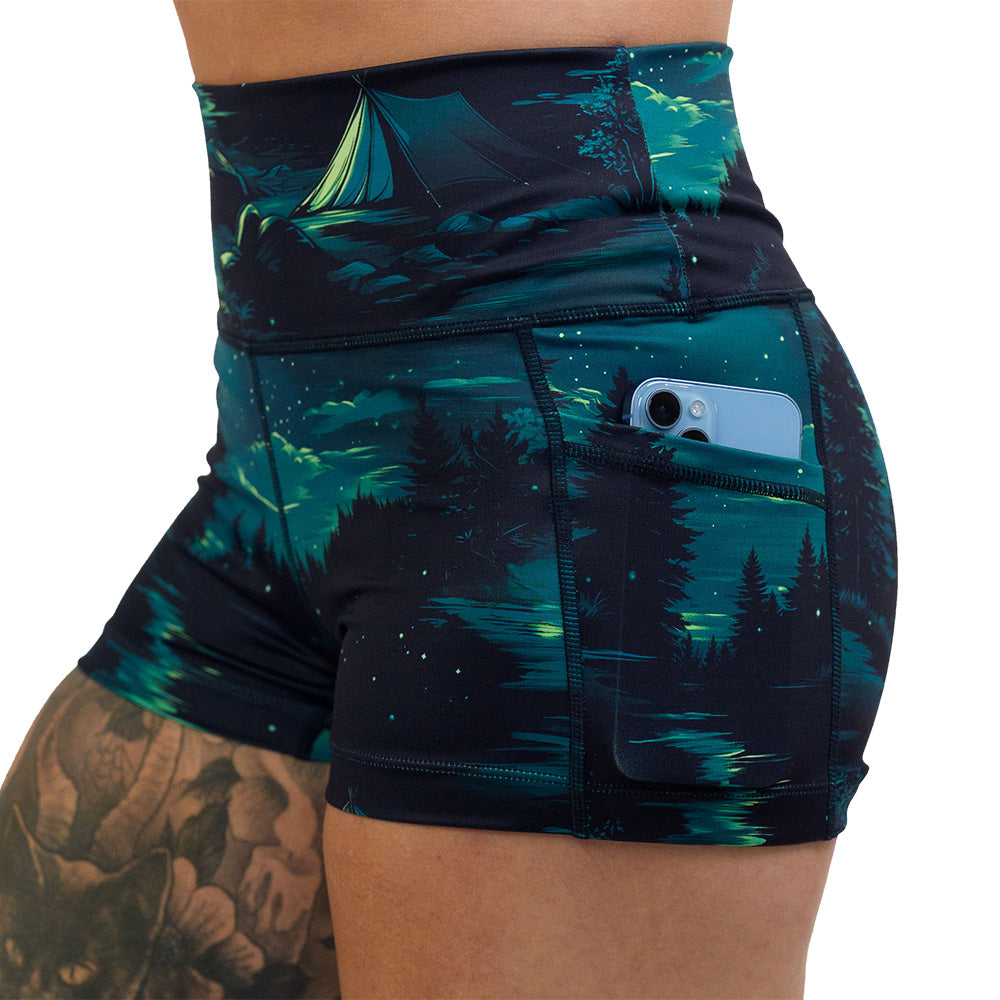 close up of the night time camp out 2.5 inch shorts with a phone in the pocket against a white background