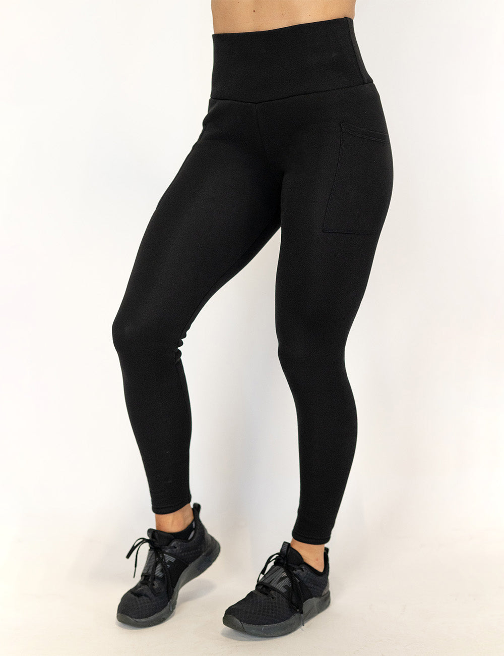 front of the solid black fleece lined leggings against a white background