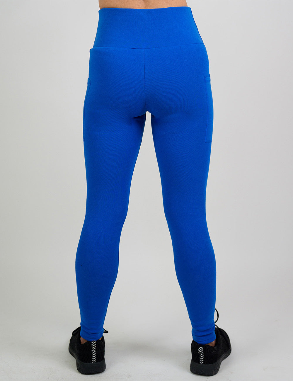 back of the solid blue fleece lined leggings against a white background