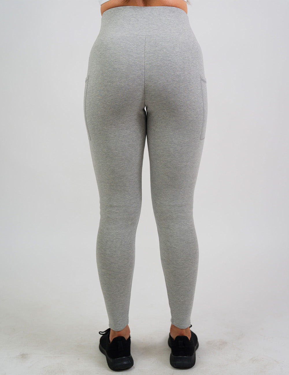 back of the solid grey fleece lined leggings against a white background