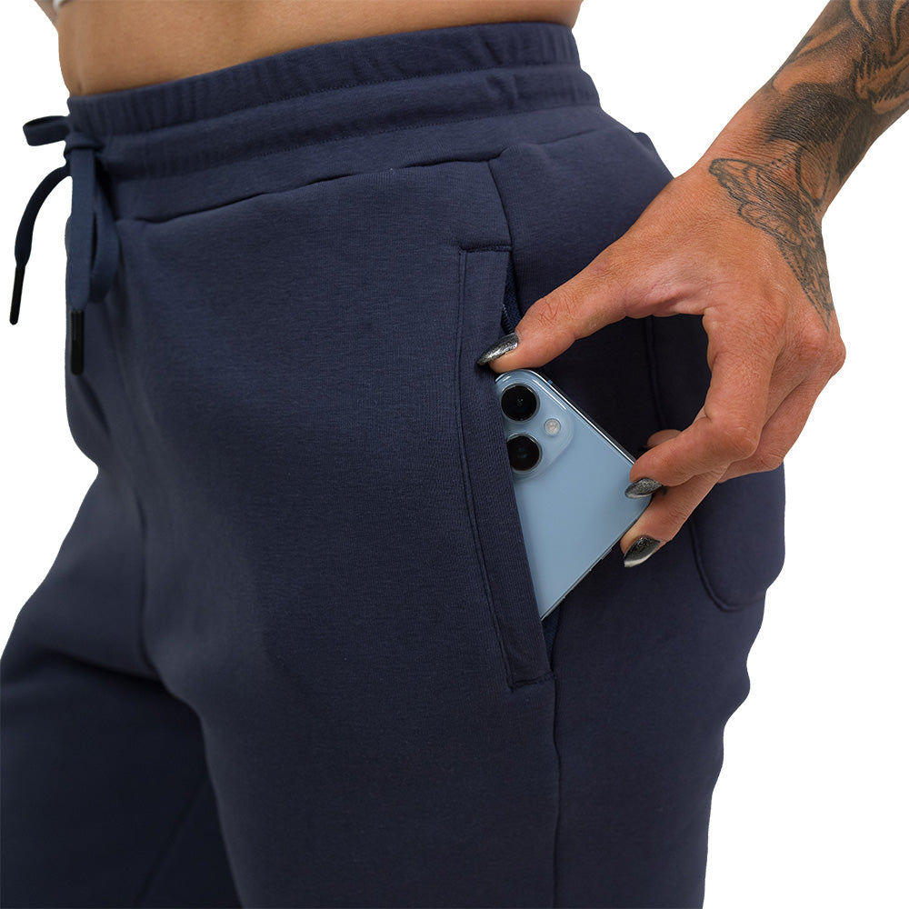 navy fleece lined rest day sweat pants close up with phone in pocket