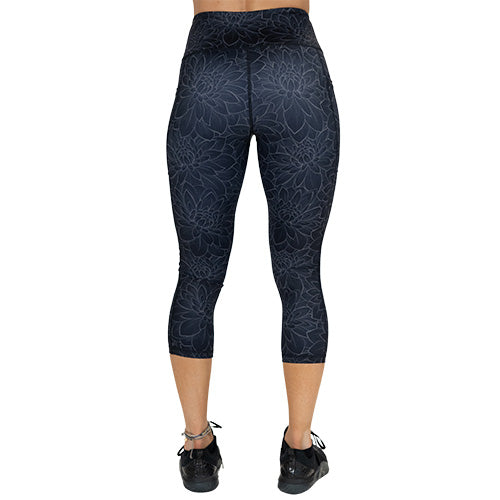back of capri length black lotus leggings