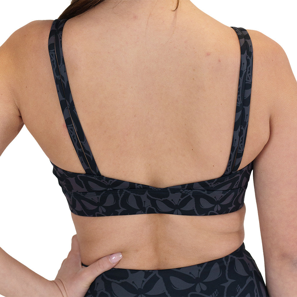 back of the grey and black butterfly shaped skulls patterned bra