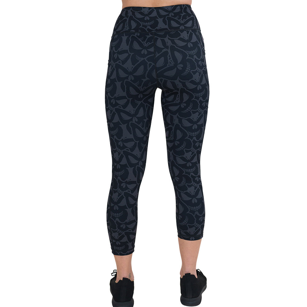 back of the grey and black butterfly shaped skulls patterned leggings