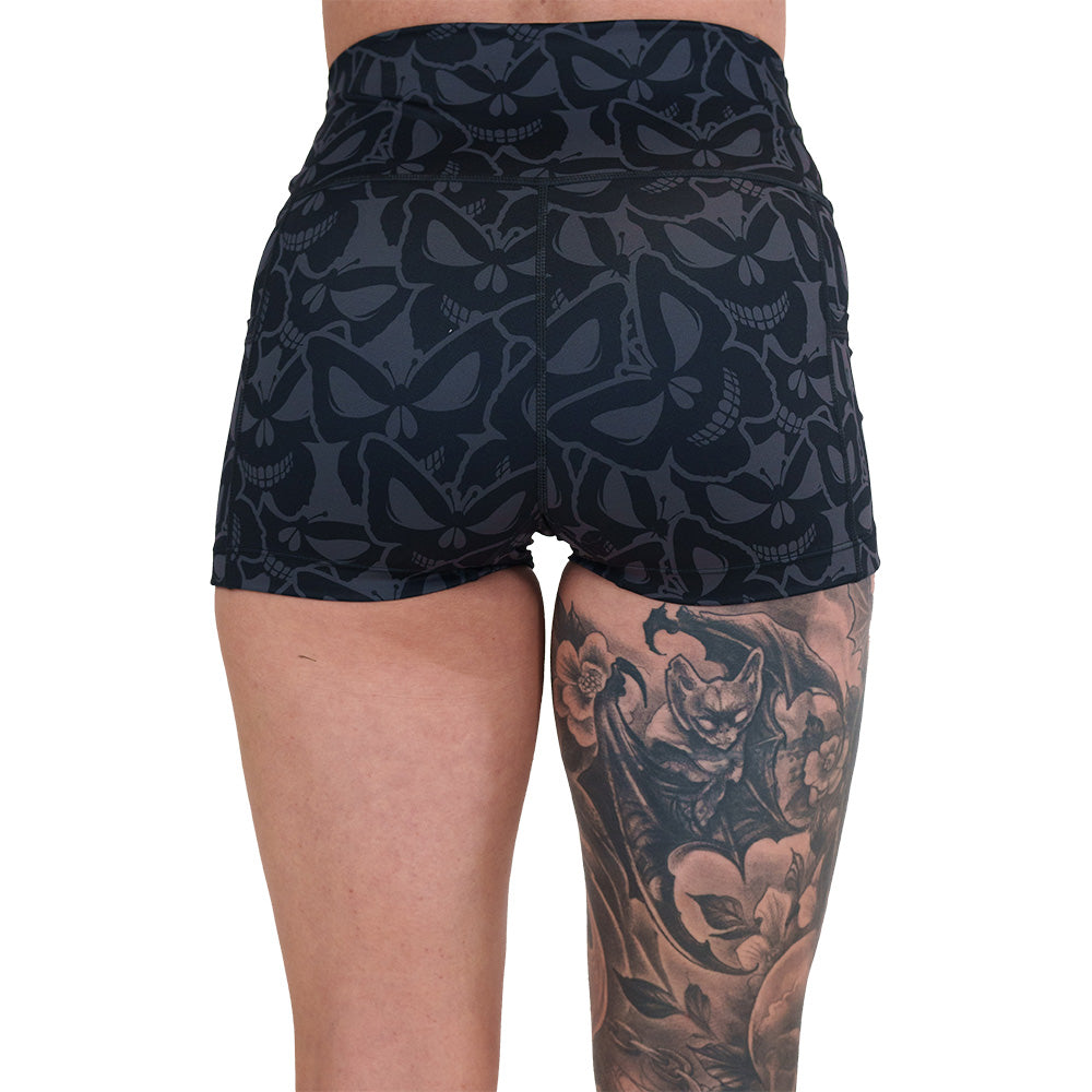back of the 2.5 inch grey and black butterfly shaped skulls patterned shorts