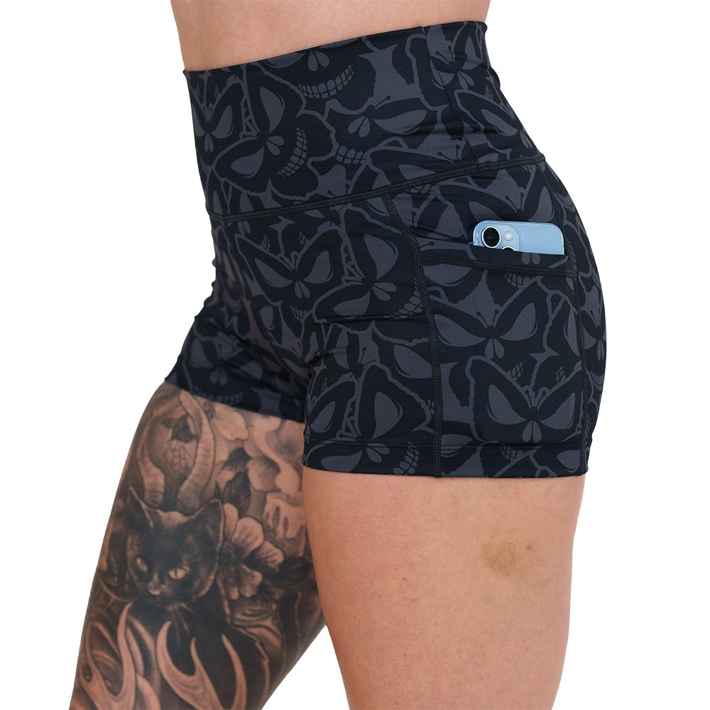 side pocket on the grey and black butterfly shaped skulls patterned shorts