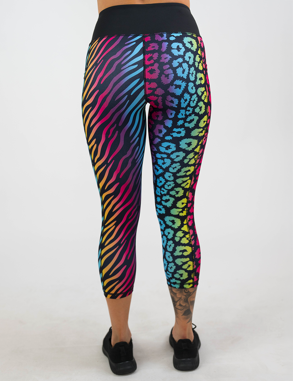 back of the zebra and leopard print capri leggings against a white background