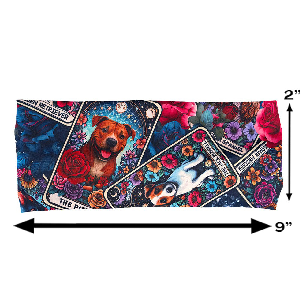 Colorful headband with dog illustration pattern on it measured at 2 by 9 inches