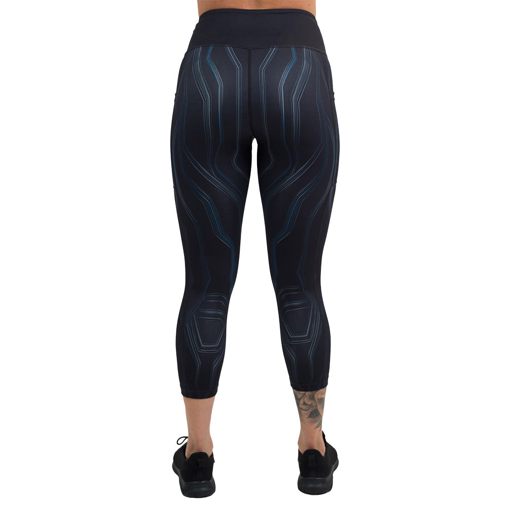 back of the black leggings with a blue pattern against a white background, capri size leggings are shown