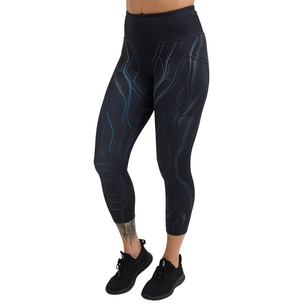 black leggings with a blue pattern facing the front against a white background, capri size leggings are shown
