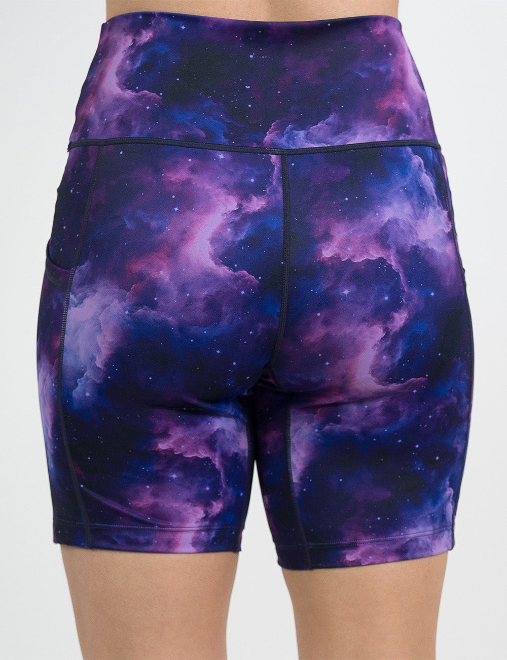 back of the 7 inch purple space patterned shorts against a white background