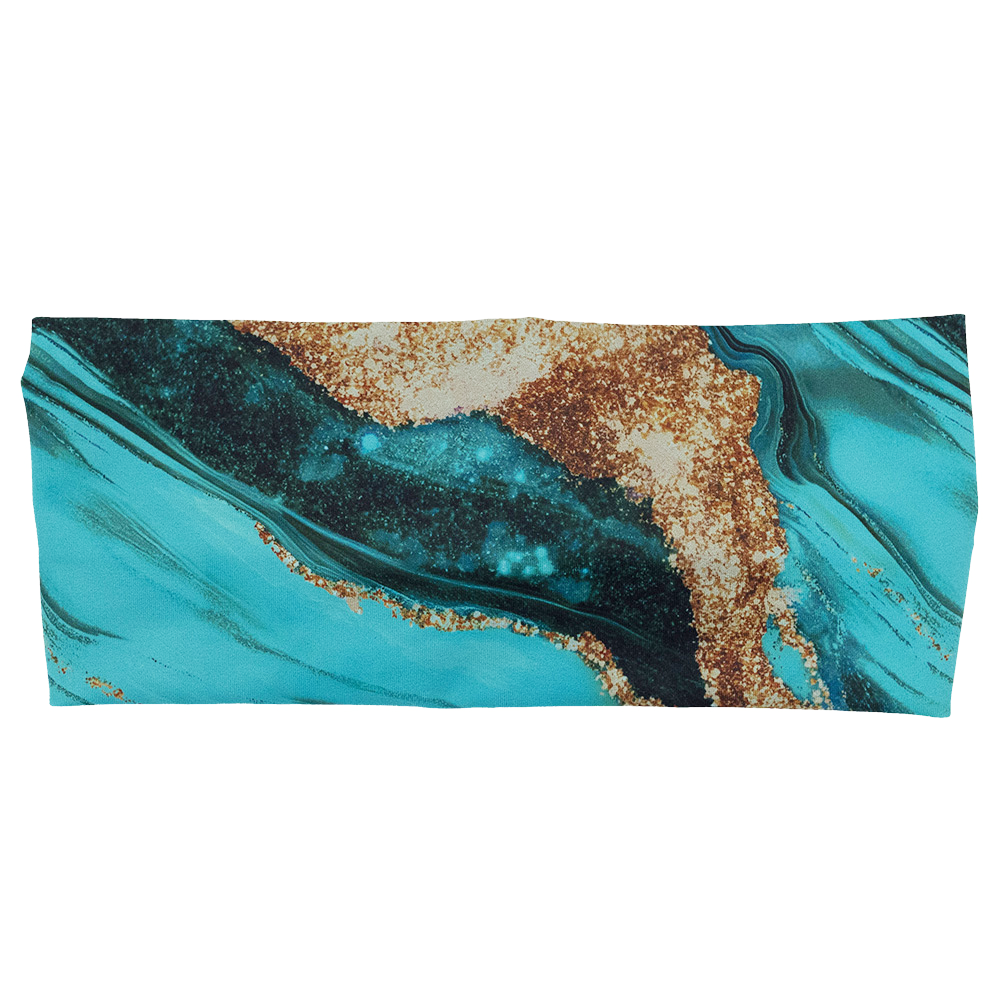 front of the blue ocean with gold streaks patterned headband against a white background