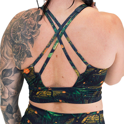 back of the spooky forest themed sports bra