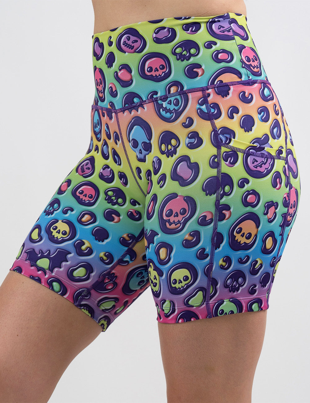 front of the 7 inch rainbow leopard print pumpkins and skulls shorts against a white background