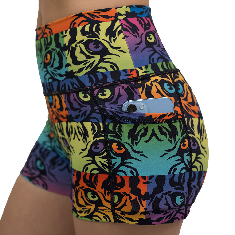 close up of phone in pocket of rainbow tiger print 2.5 inch shorts against a white background