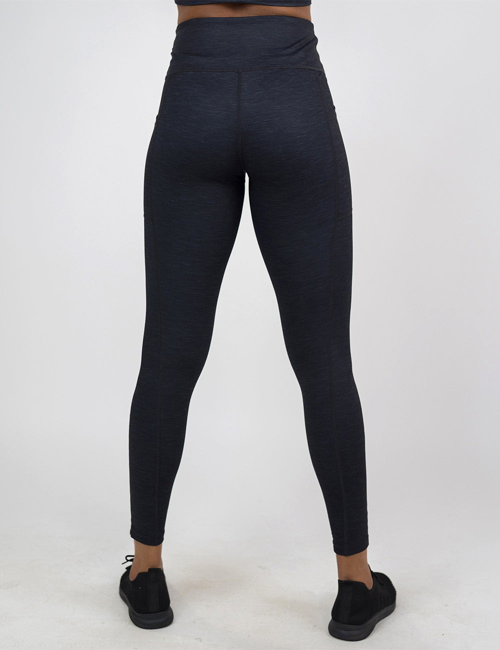 back of the full length black heather pattern leggings against a white background