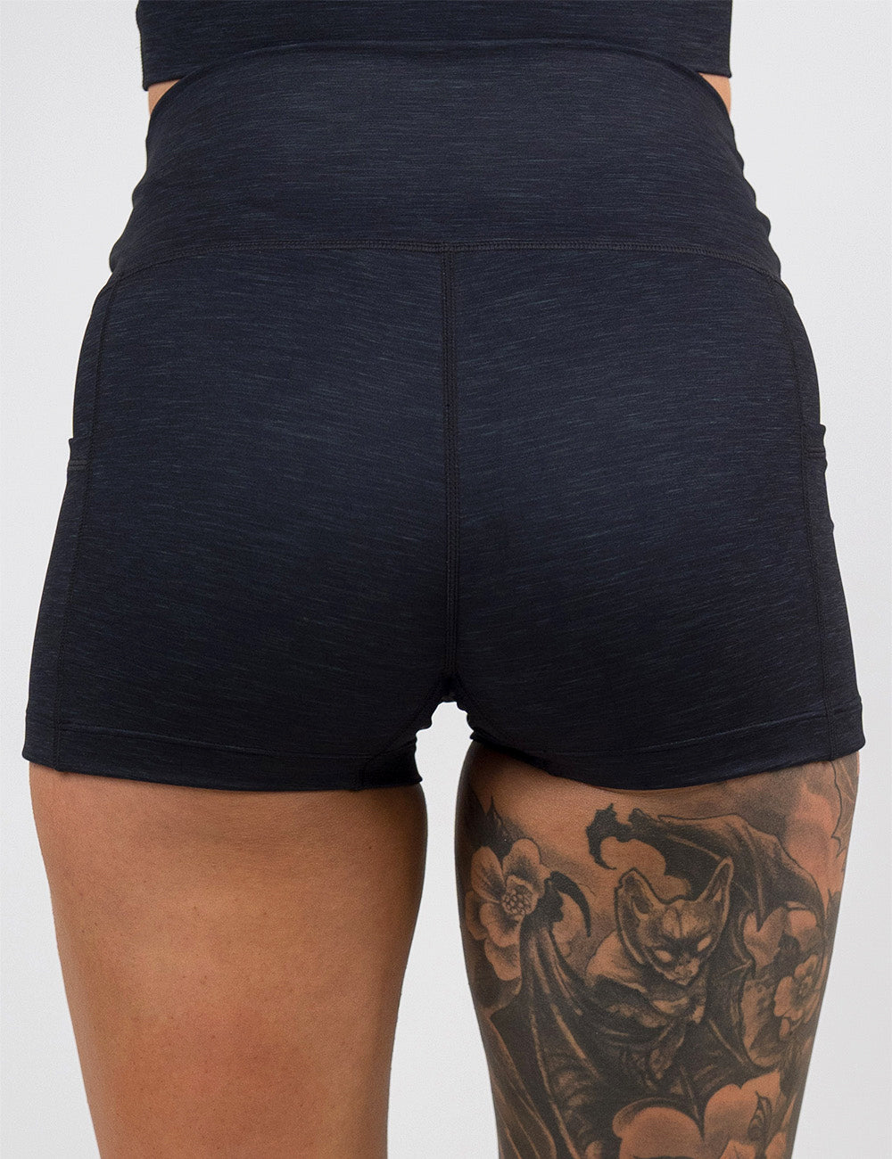 back of the 2.5 inch black heather pattern shorts against a white background
