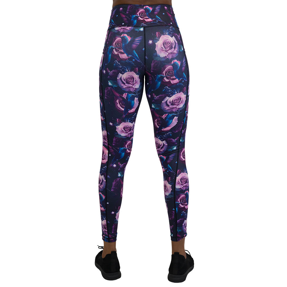 back of the leggings with a design of a blue hummingbird and pink roses