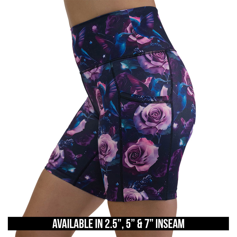 shorts with a design of a blue hummingbird and pink roses