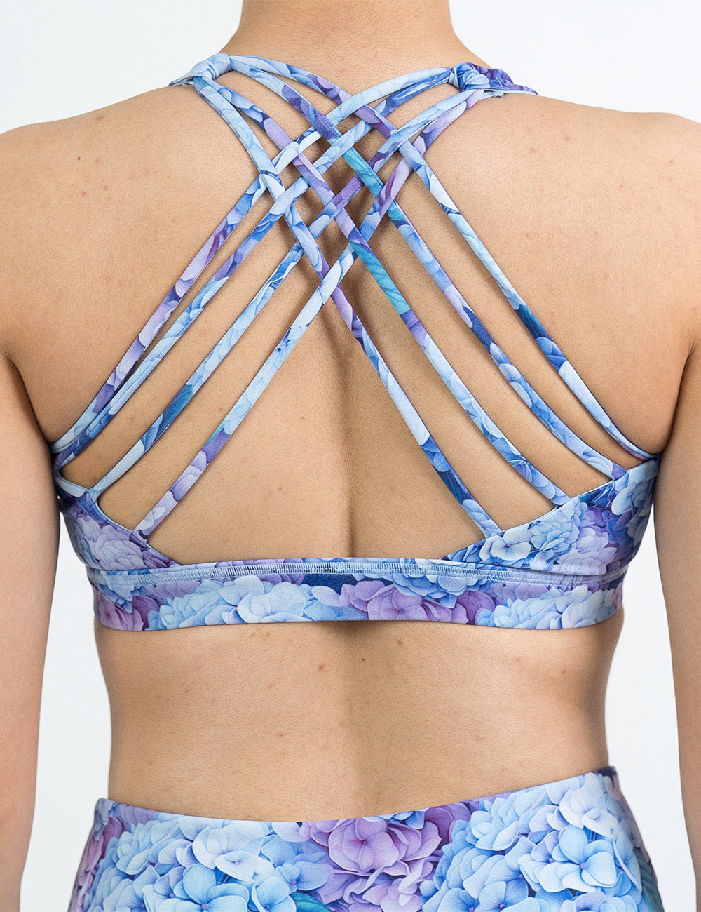 back of the pastel blue and purple hydrangea flower butterfly back bra against a white background